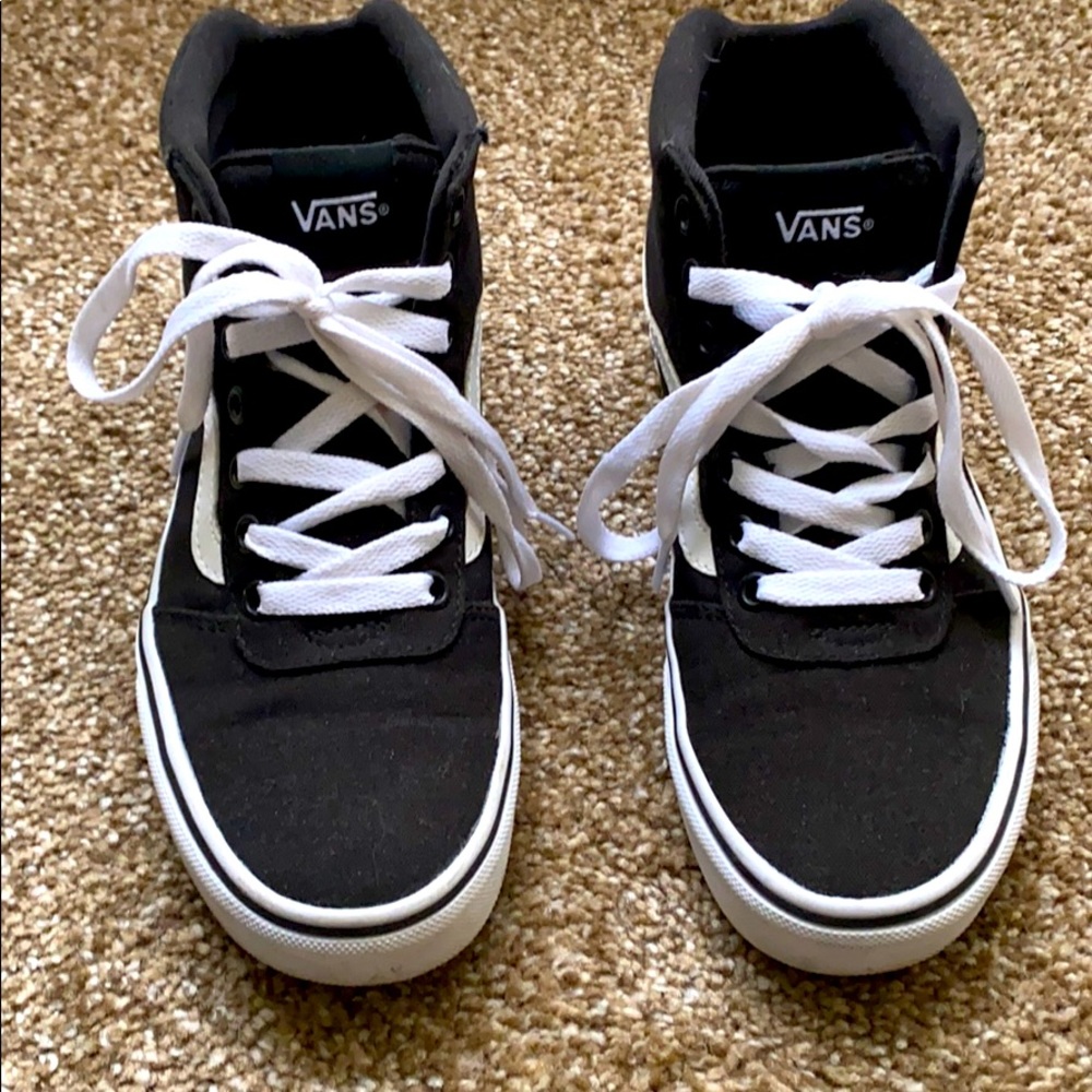 Black and white high top vans